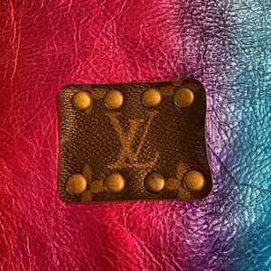 LV patch tassel bag